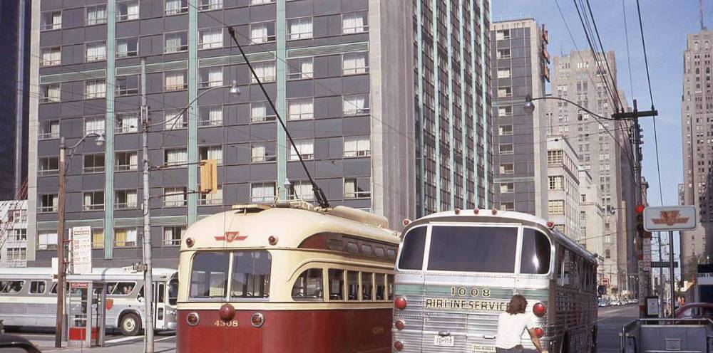 a photo - toronto - king just w of university looking e ground level - pcc streetcar and airline bus - lord simcoe hotel - you can see a bit of old globe and mail building at 140 king w